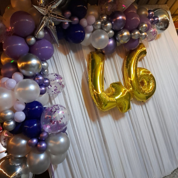 Organic balloon gala backdrop with balloon numeral