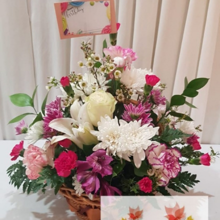 Mixed floral arrangement in basket